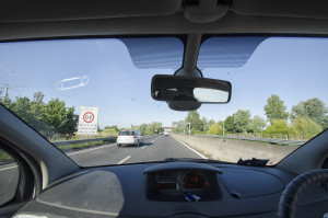 View of the dashboard of the car on the highway